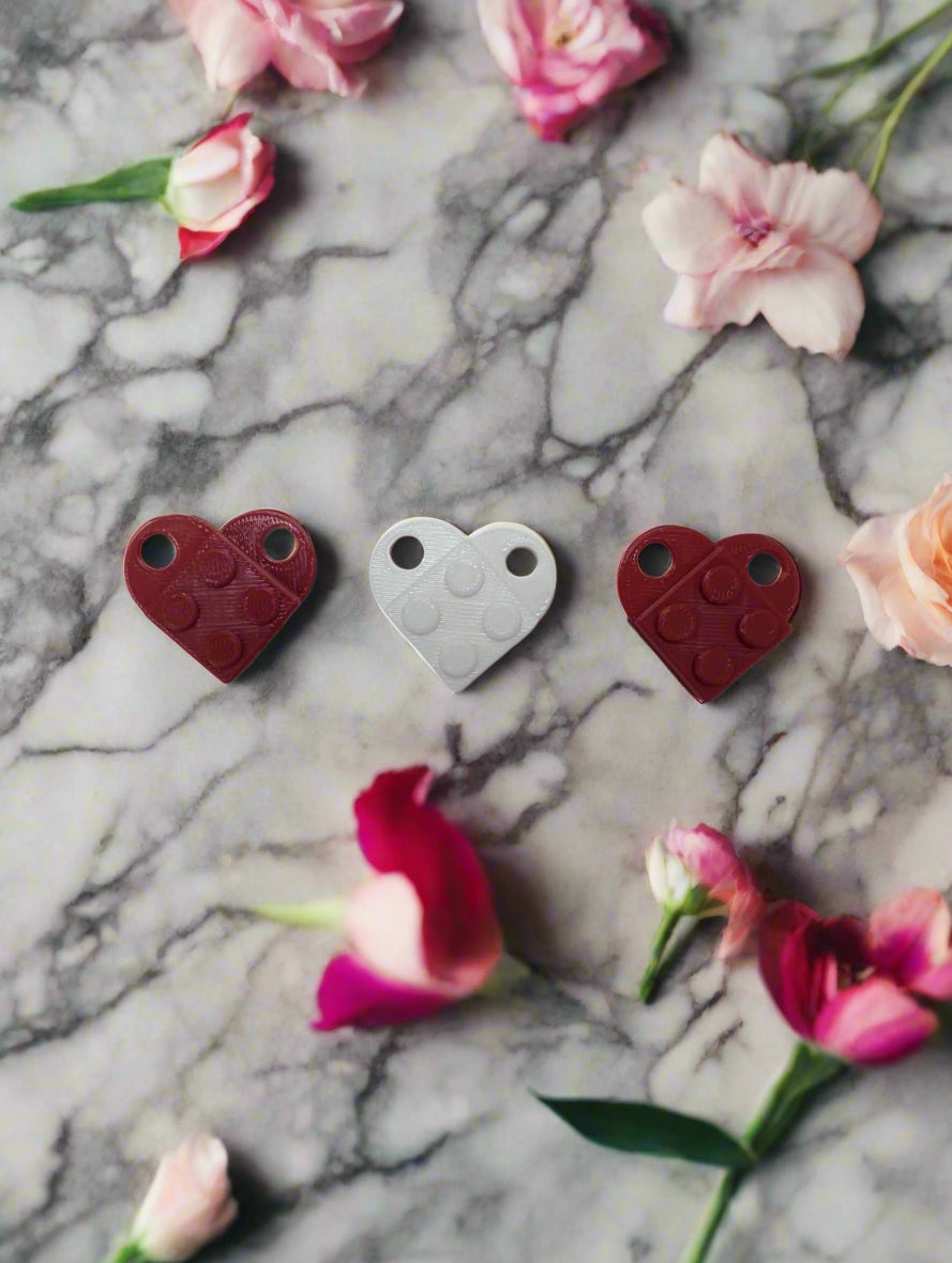 Heart keychains in marble table.